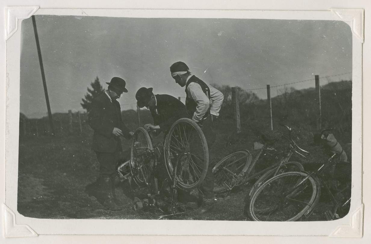 Missionaries repairing bicycles